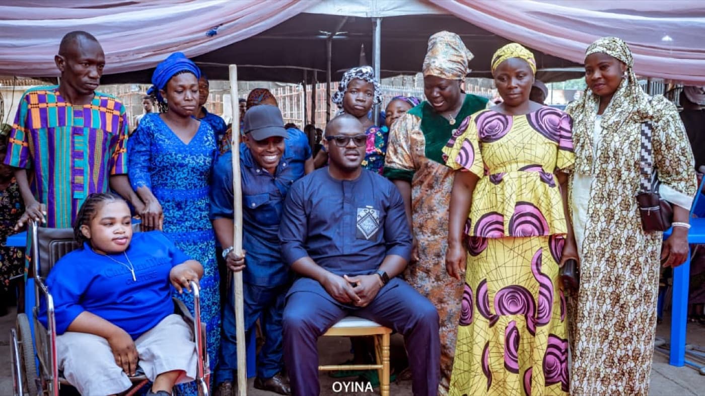 OYNA members and community leaders posing together after a program