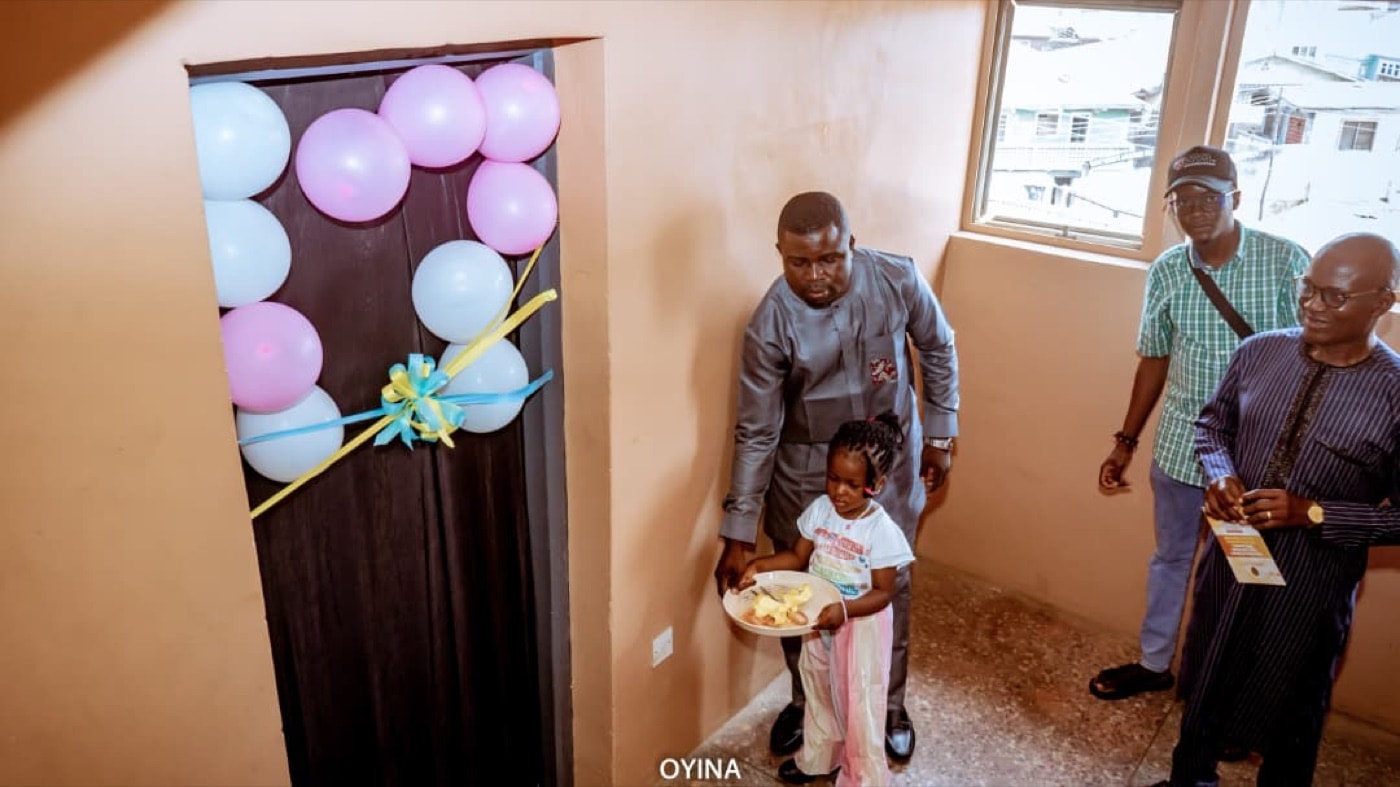 A family entering a newly opened community facility
