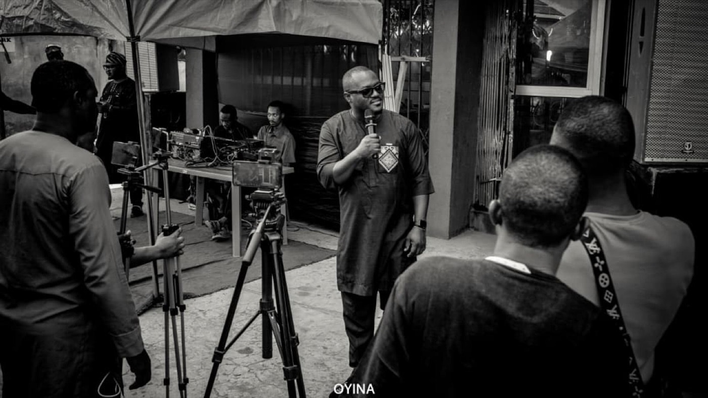A speaker addressing guests at an indoor OYNA event