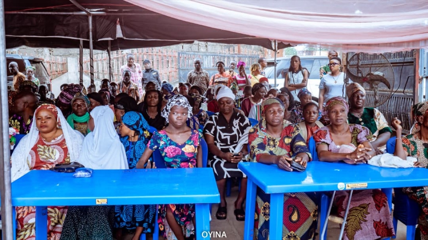 Ogbomoso community members gathered under an event canopy